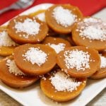 Kutsinta (sticky brown rice cake) garnished with grated coconut.