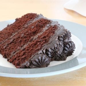A slice of chocolate cake with Dark Chocolate Cream Cheese Frosting.