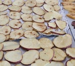 Unbaked slices of Pumpkin Spice Baked Sweet Potato.