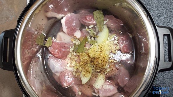 Saute pork adobo using an instant pot.