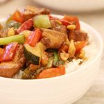 Panda Express Kung Pao Chicken Recipe (Copycat) in a bowl of jasmine rice.