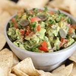 This is the best ever guacamole recipe paired with tortilla chips.