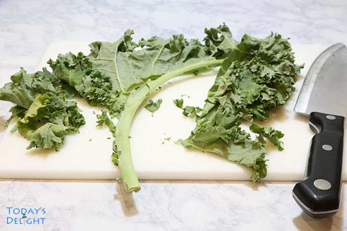 Cutting kale leaves.