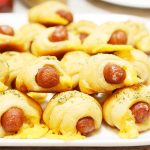 Crescent Roll Pigs in a Blanket layered on top of each other..