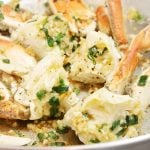 Stir fry dungeness crab in skillet.