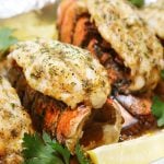 3 broiled lobster meat on top of lobster shell.